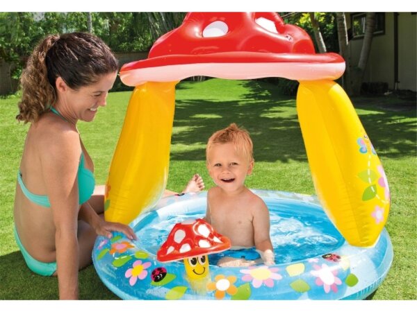 Ein niedlicher Baby Pool, mit einem Dach im Pilz Design. Süße kleine, bunte Pilze am Rand regen ihren kleinen Schatz beim Planschen zum Entdecken an, das integrierte Dach schützt ihr Baby vor der Sonne. Mit Sonnendach, Reparatur-Set und aufblasbarem Boden
